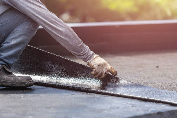 Professional Waterproofing technician working in Falkville, AL